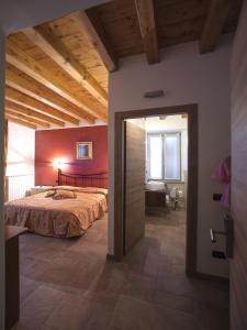 Postel nebo postele na pokoji v ubytování B&B Sant'Antonio De Foris