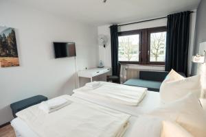 Postel nebo postele na pokoji v ubytování Hotel Scharfes Eck