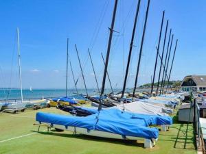 a bunch of sailboats are lined up in a dock at Holiday chalet Cowes Isle of Wight in Gurnard