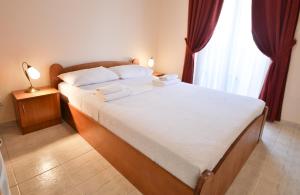Postelja oz. postelje v sobi nastanitve Hotel Podostrog