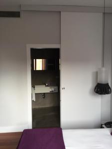 Ein Bett oder Betten in einem Zimmer der Unterkunft Khu Hotel