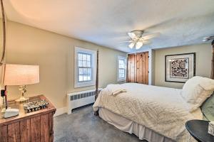 a bedroom with a bed and a ceiling fan at All Year-Round Retreat Near Windham Mountain 