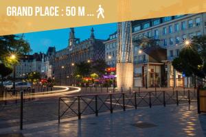 a view of a city street at night at Calme/ Confortable / Esthétique / Centre-ville in Valenciennes