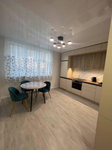 Kuchyň nebo kuchyňský kout v ubytování Deluxe apartments - Viva Ukraine