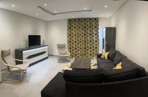 Televízia a/alebo spoločenská miestnosť v ubytovaní Appartement brest st-marc 6-8personne 2min centre