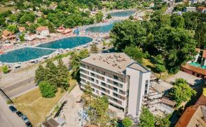 an aerial view of a resort with two pools at Emma Park Lake in Tuzla