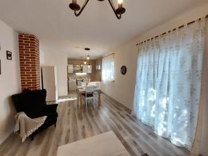 a living room with a couch and a table at Villa Blatina in Gradac