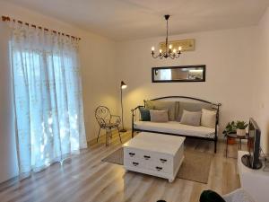 a living room with a bed and a table at Villa Blatina in Gradac