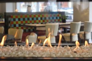 
a table that has some candles on it at Hotel La Terrasse in De Panne
