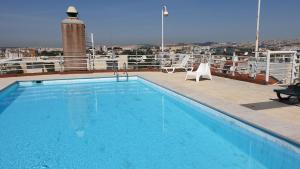 a swimming pool on top of a cruise ship at Apart Lisbon Pool Metro Garage in Lisbon