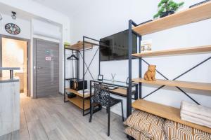 a room with a desk and a loft bed at Nice Centre Flat - Modern, Quiet and Brand New in Nice