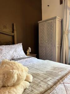 Postel nebo postele na pokoji v ubytování Tres Fuentes Hotel Boutique