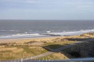 a view of a beach with the ocean at The Loft - Full Sea View - use of hotels Sauna and Pool in Cadzand