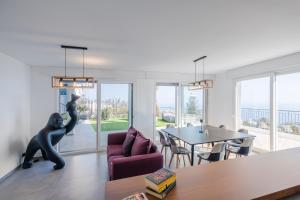 a living room with a couch and a table at Villa la Matta in Sanremo