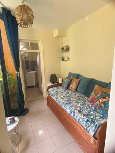 a living room with a couch and a table at Dazk Golden Estate in Ribeira Brava