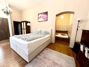 Ένα ή περισσότερα κρεβάτια σε δωμάτιο στο Home Away main square apartment