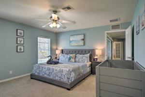 a bedroom with a bed and a ceiling fan at 15 Mi to Beach Home with Pool in Cape Coral in Cape Coral +29 photos
