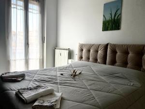A bed or beds in a room at Appartamento Le Risaie
