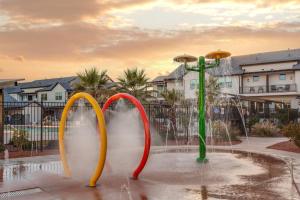 a fountain with three colorful handles in a park at Ocotillo 69 3 Bedrooms with a Private Hot Tub, Fire Pit, and Private Patio in Santa Clara