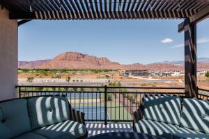 a balcony with two chairs and a view of a mountain at Ocotillo 70 Red Mountain View Resort, Private Pool & Hot Tub in Santa Clara