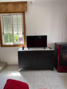 TV a/nebo společenská místnost v ubytování Apartamentos Gamela en Playa Canido - Vigo