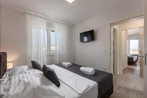 Posteľ alebo postele v izbe v ubytovaní Apartments Cesare