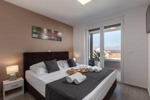 Posteľ alebo postele v izbe v ubytovaní Apartments Cesare