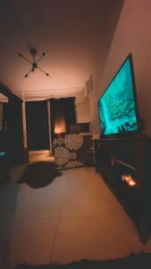 A television and/or entertainment centre at Restful and trendy apartment in 6 October city Cairo