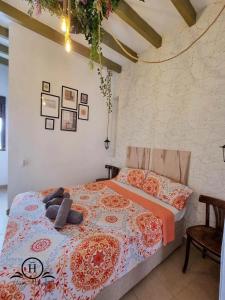 Ένα ή περισσότερα κρεβάτια σε δωμάτιο στο Garden HappyAlicante