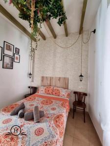 Ένα ή περισσότερα κρεβάτια σε δωμάτιο στο Garden HappyAlicante