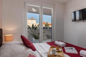 Posteľ alebo postele v izbe v ubytovaní Apartments Cesare