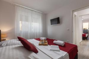 Posteľ alebo postele v izbe v ubytovaní Apartments Cesare