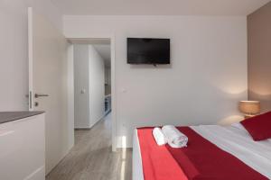 Posteľ alebo postele v izbe v ubytovaní Apartments Cesare