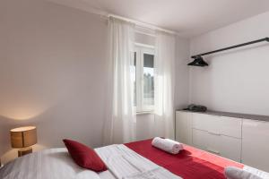 Posteľ alebo postele v izbe v ubytovaní Apartments Cesare
