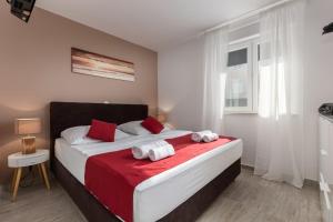 Posteľ alebo postele v izbe v ubytovaní Apartments Cesare