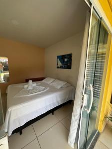 Postel nebo postele na pokoji v ubytování Casa Temporada Suítes