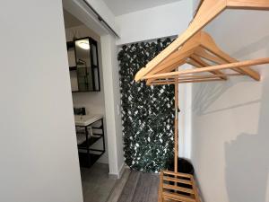 a hallway with a wall with a plant at IN-Cascais Suite Deluxe com pátio privado in Cascais