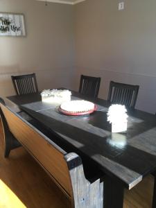 a black table with a cake on top of it at beautiful house in the hills in Altadena