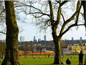 a group of people in a park with trees at Victorian Building turned Charming Hotel Perfect For Short and Long Term Stay with WiFi in London +19 photos