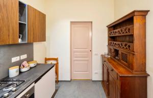 a kitchen with a stove and a counter top at Cuore della città by Home a porter in Turin