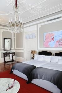 Tempat tidur dalam kamar di Palacete Chafariz Del Rei - by Unlock Hotels