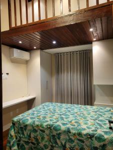 Ένα ή περισσότερα κρεβάτια σε δωμάτιο στο Condominio Winterville 3 Quartos