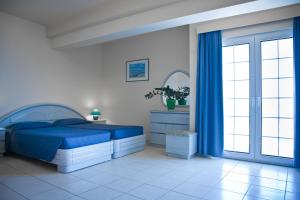 Postel nebo postele na pokoji v ubytování Creta Hotel