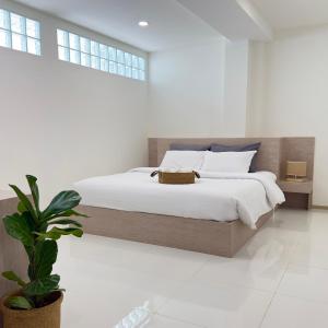 Postel nebo postele na pokoji v ubytování Darin Chiangmai Hotel and Residence