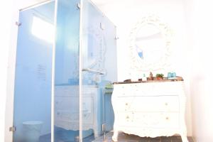 a dressing room with a mirror and a white dresser at 恆春洋蔥風格旅居 onion in in Hengchun