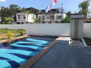 a swimming pool in the backyard of a house at GRHA AWEN SLEMAN in Beran-kidul
