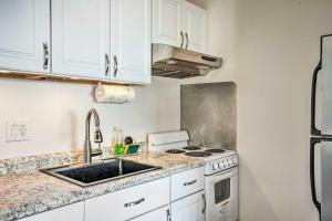 a kitchen with a sink and a stove at San Francisco Area Studio with Bay Views! in Emeryville