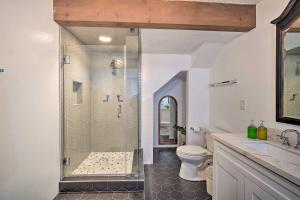 a bathroom with a shower with a toilet and a sink at Running Springs Home with Skiing Less Than 6 Mi Away! in Running Springs +30 photos