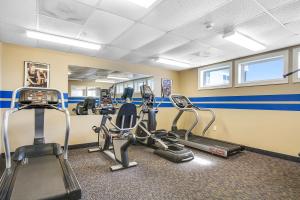 a gym with treadmills and ellipticals in a room at Belmont Towers 608 in Ocean City