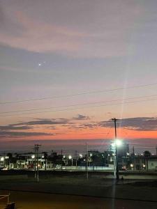 a view of a city at night with a street light at DEPARTAMENTO AMOBLADO CERCANO A PLAYA in Ilo
